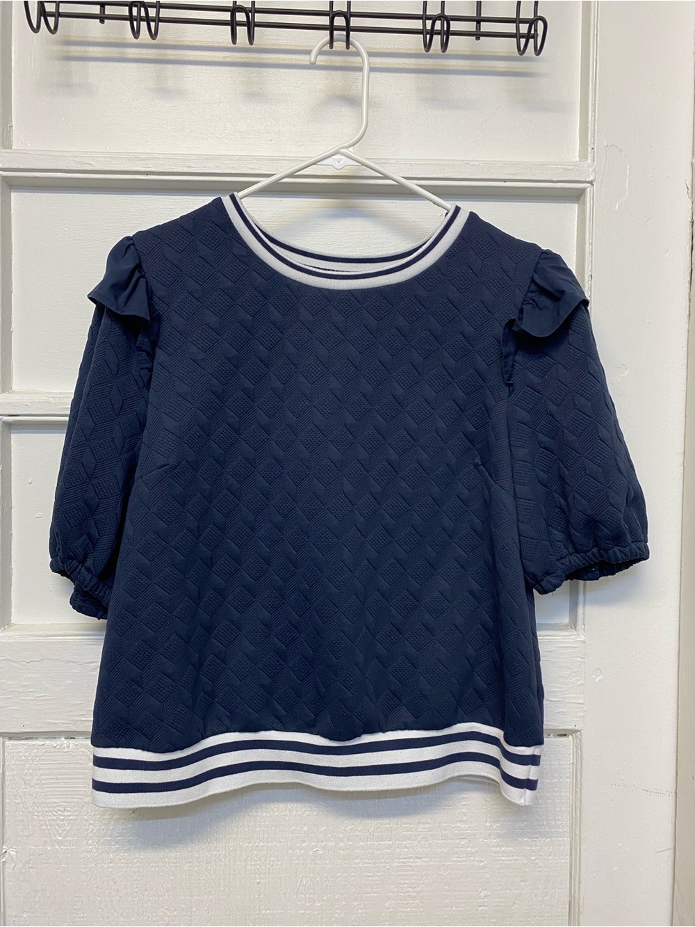 Voy Navy Blue Textured Blouse features ruffled cap sleeves and striped band Larg